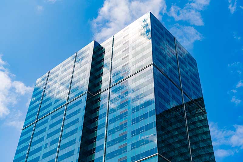 acquisition financing real estate: photo of reflective glassy skyscraper