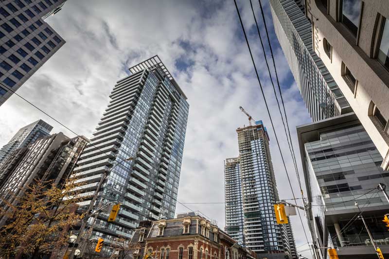 business construction financing - photo of skyscrapers, looking upward from ground level.