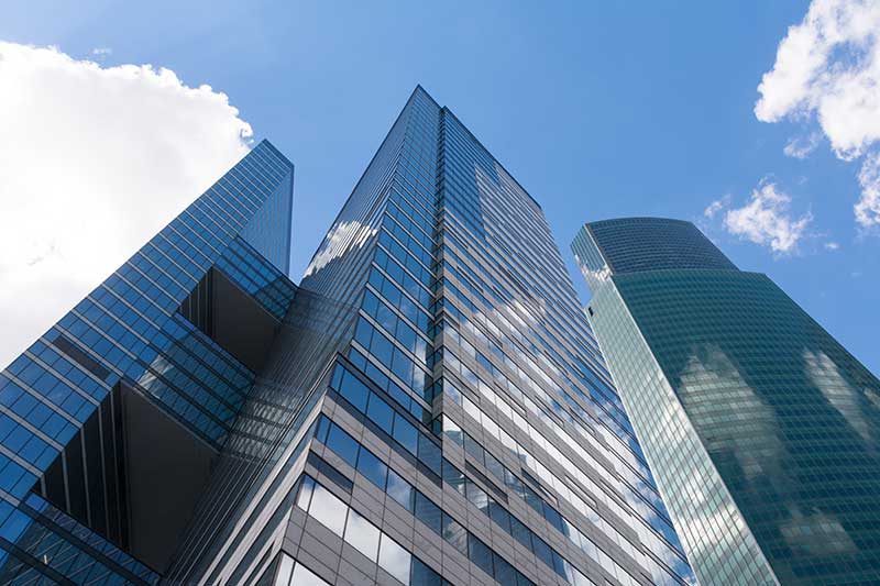 cash out financing for real estate - photo of modern skyscrapers, photographed from below.