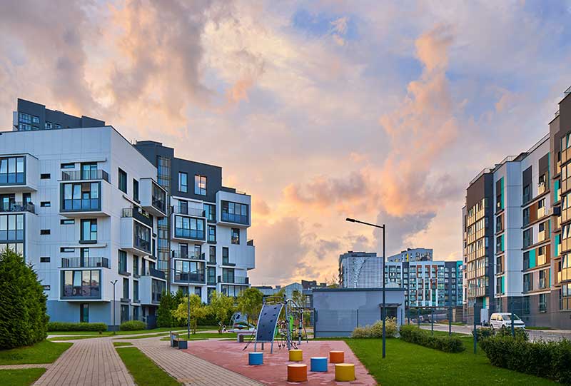 financing for condo investment property -photo of residential condo development at night.