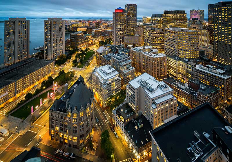 hospitality loans and financing company - aerial photo of Boston, with time lapse traffic effects.