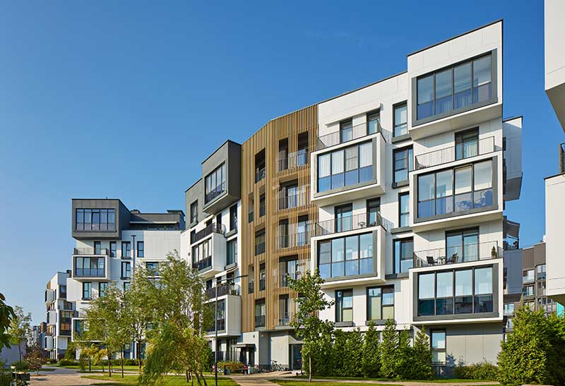 real estate mezzanine loans - photo of new modern apartment building development.